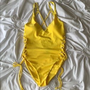 Bright yellow one piece swim suit